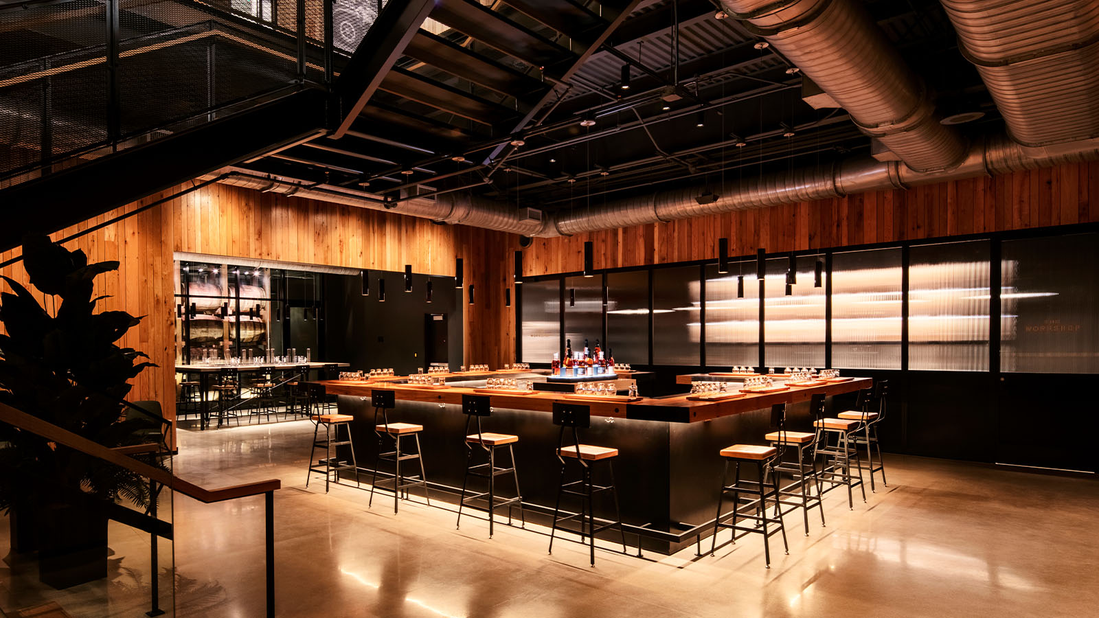 Modern, industrial interior of the Fred B. Noe Distillery tasting bar and gathering space.