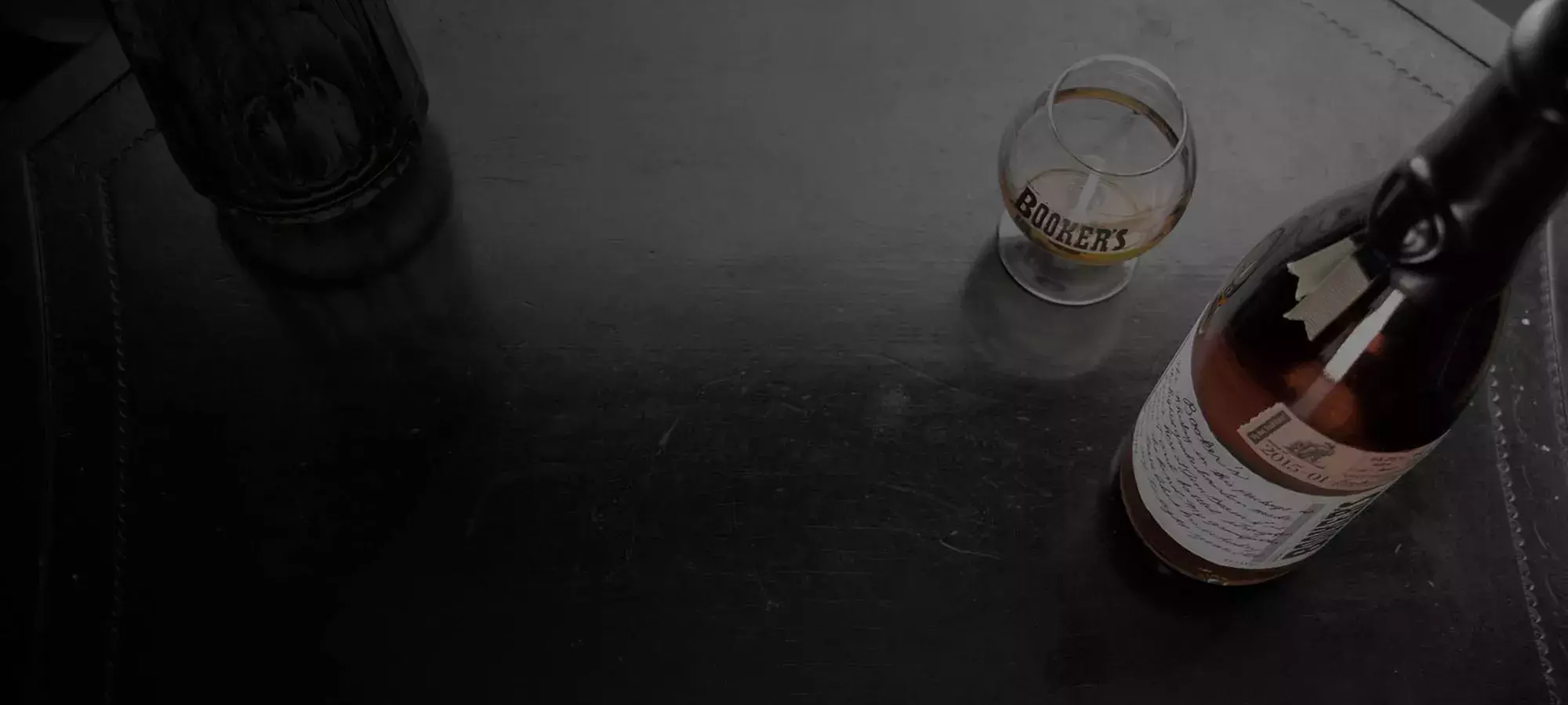 Booker’s bottle and glass background