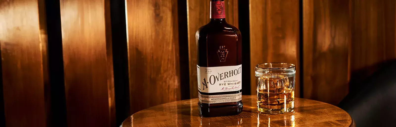 Bottle and drink of American Whisky Old Overholt