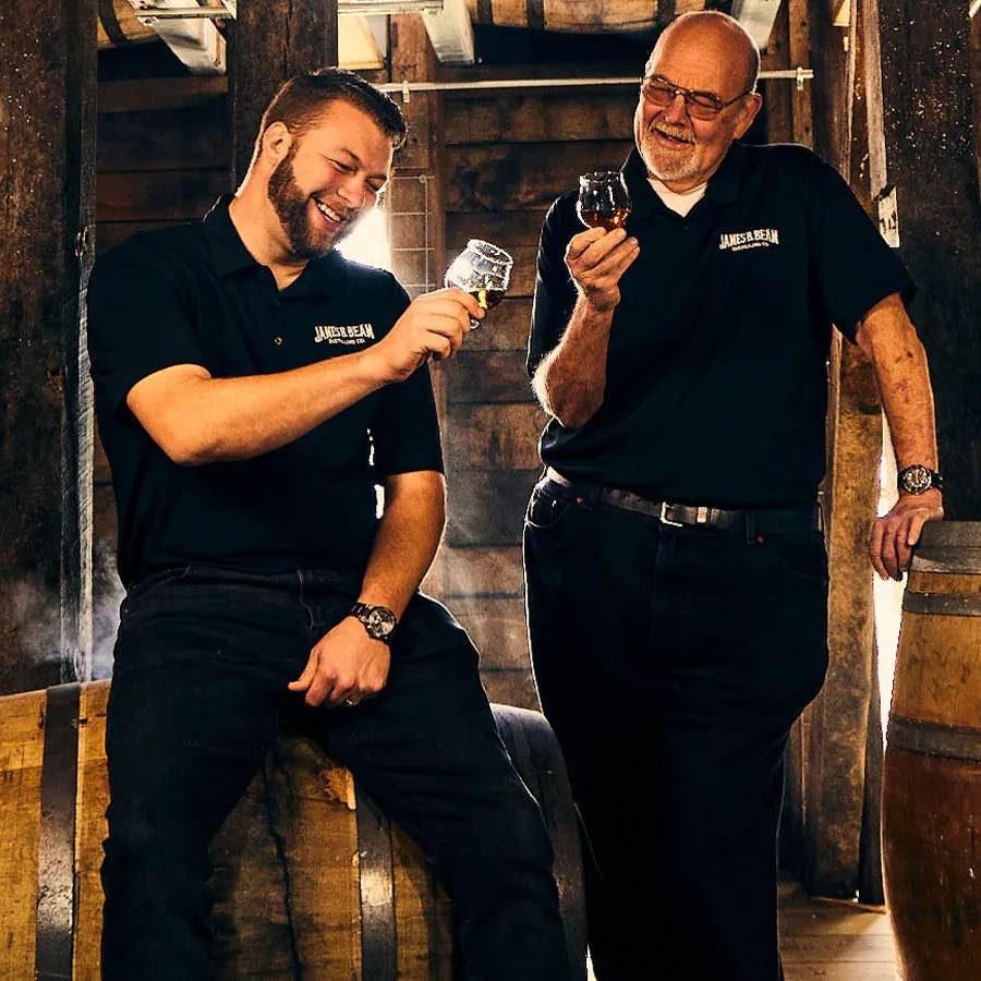 7th and 8th Master Distillers Fred and Freddie Noe of James B. Beam Distilling Co. toasting with Hardin Creek Whiskey.