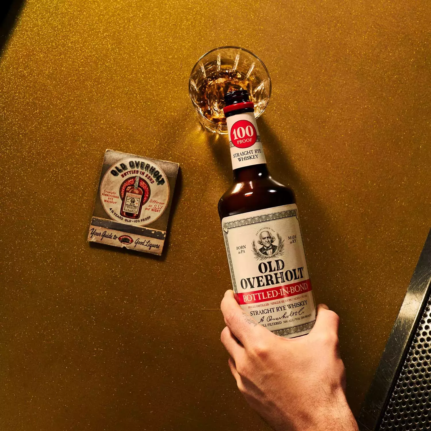 Hand pouring Bottled-in-Bond Straight Rye American Whisky Old Overholt.