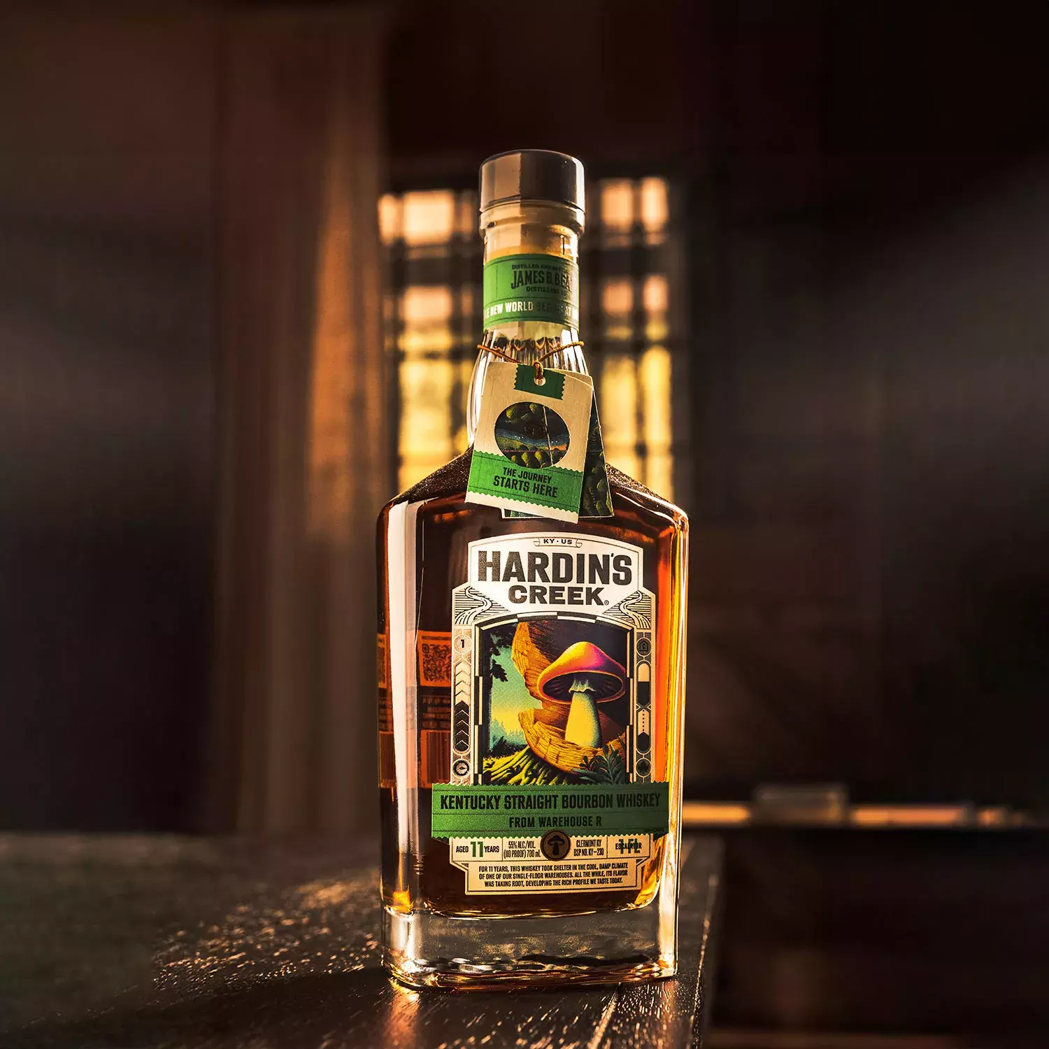 Square whiskey bottle with a label featuring a bright, illuminated mushroom illustration Bottle Whisky Hardin's Creek 