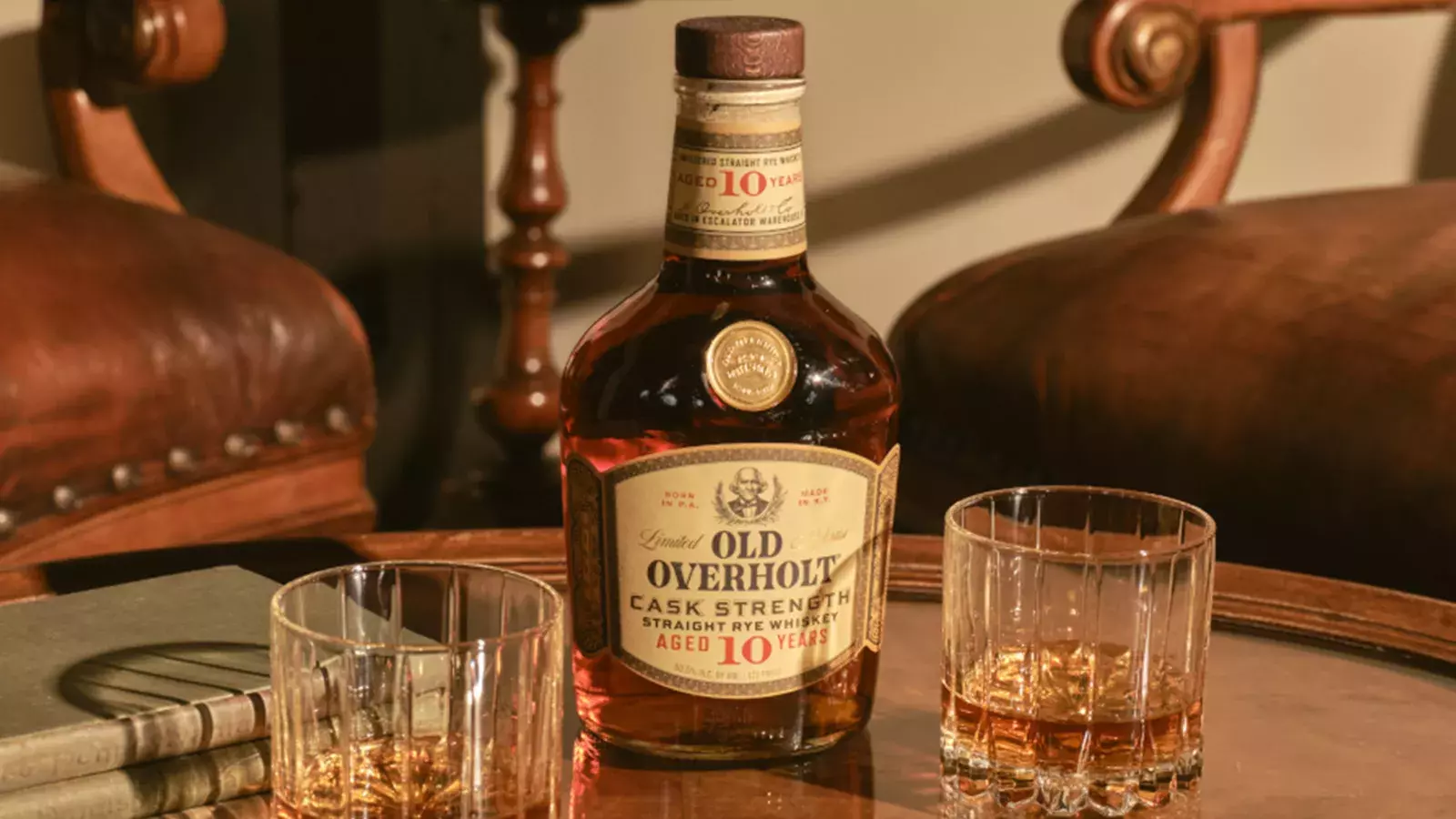 Bottle of Old Overholt 10 Year Cask Strength with two whiskey glasses, American Whisky Old Overholt.