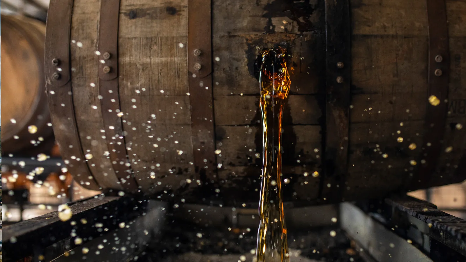 Bourbon pouring from a barrel during the "dump" process. James B. Beam Distilling Co. production.