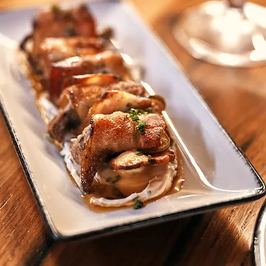 Close-up of signature duck poppers from the menu at The Kitchen Table restaurant at Beam.