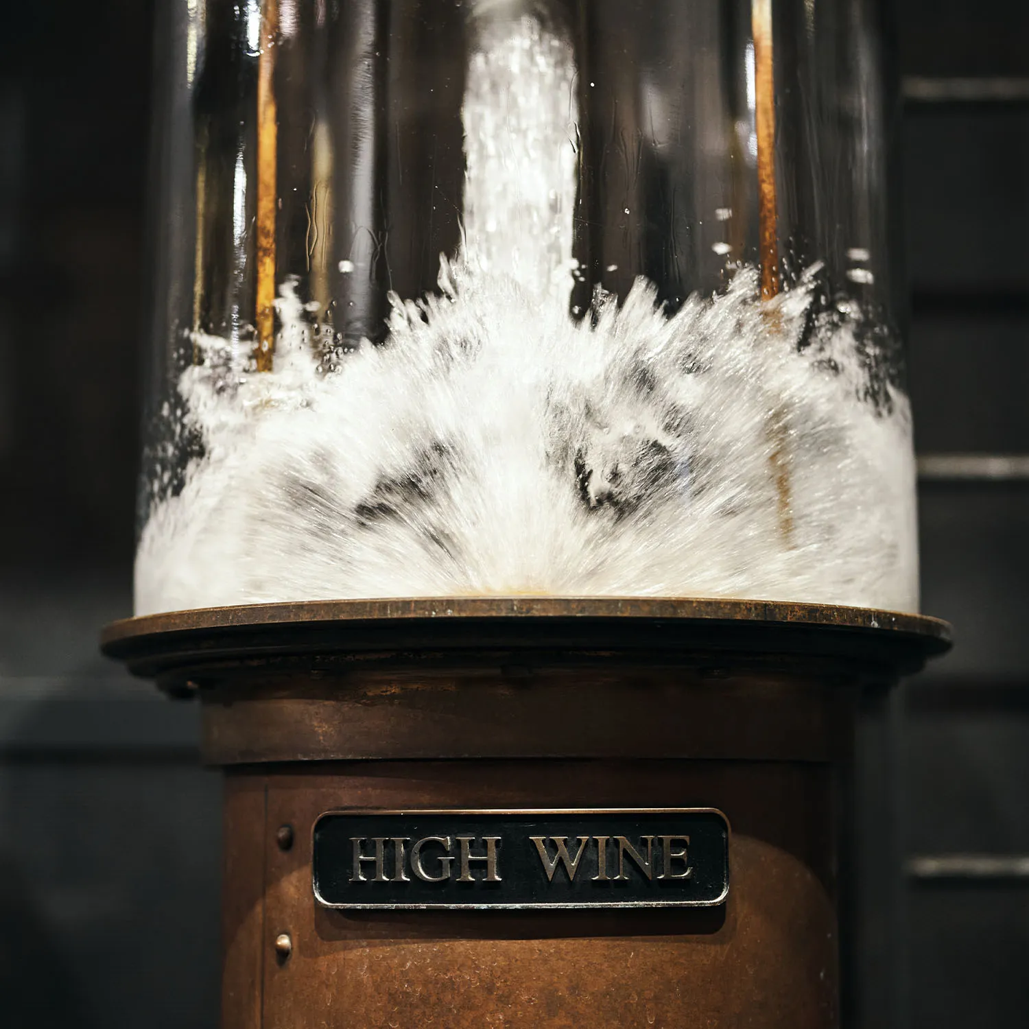 Close up of High Wine flowing during the distillation process at James B. Beam Distilling Co. for bourbon.