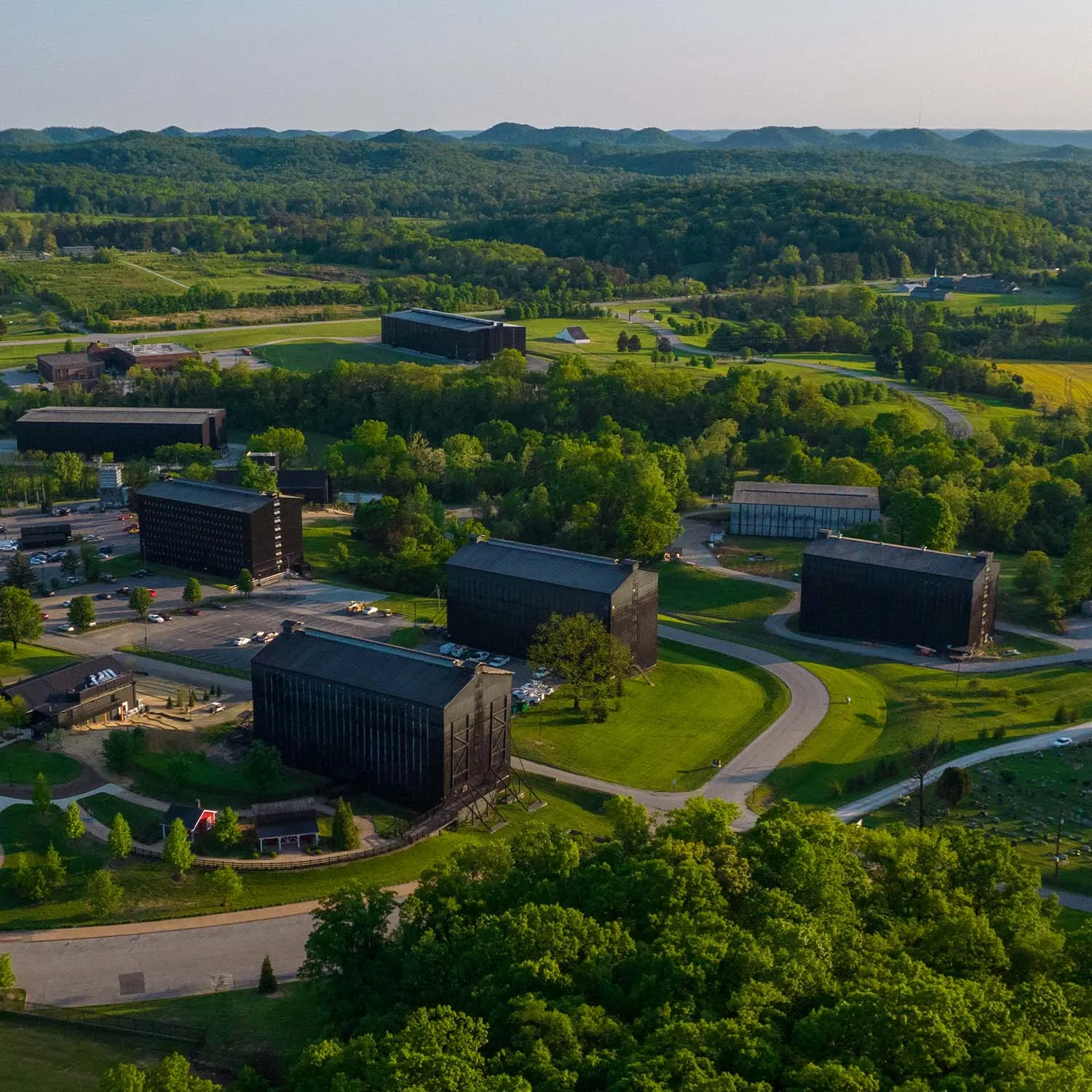 Drone shot of the Beam distillery rickhouses and warehouses in the Kentucky landscape.