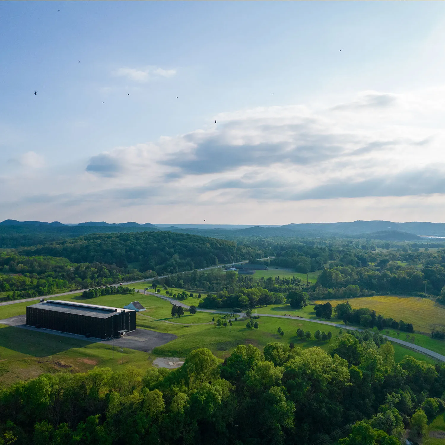 Aerial view of James B. Beam Distilling Co. campus, nestled in the green Kentucky rolling hills.