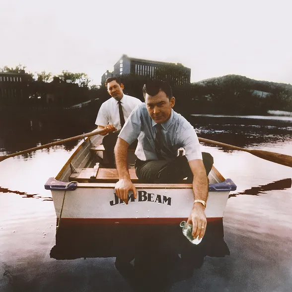 Vintage image of Booker and Baker Beam on a Jim Beam boat at James B. Beam Distilling Co.