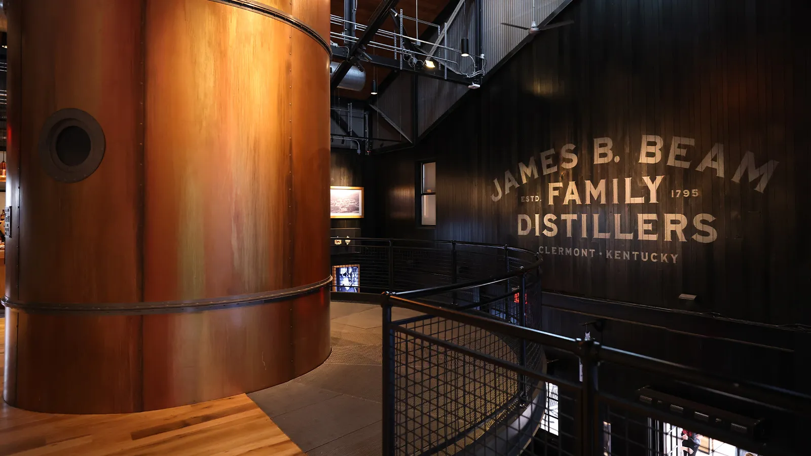 Interior view of the American Output building with a large copper column and branded sign