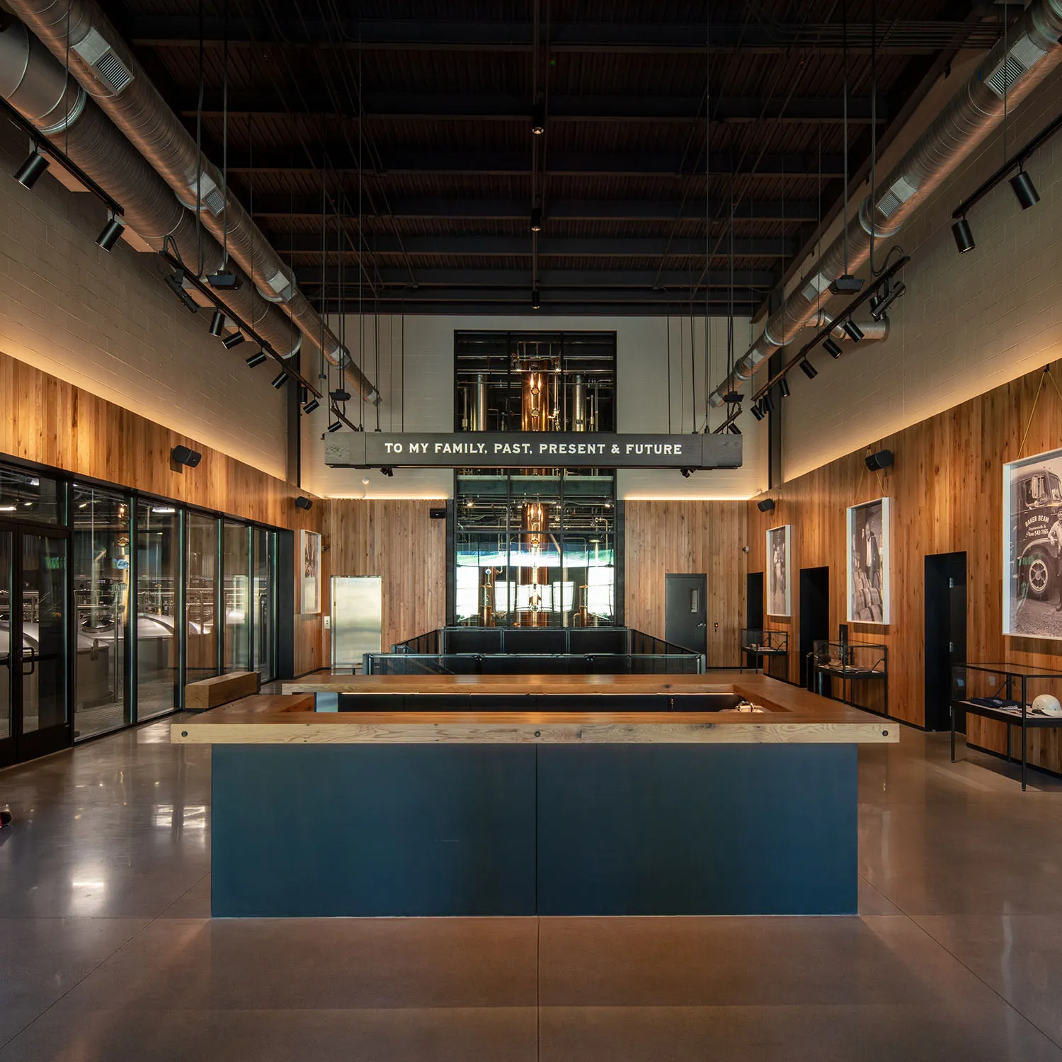 Modern, industrial interior of the Fred B. Noe Distillery with tasting bar and wood accents.