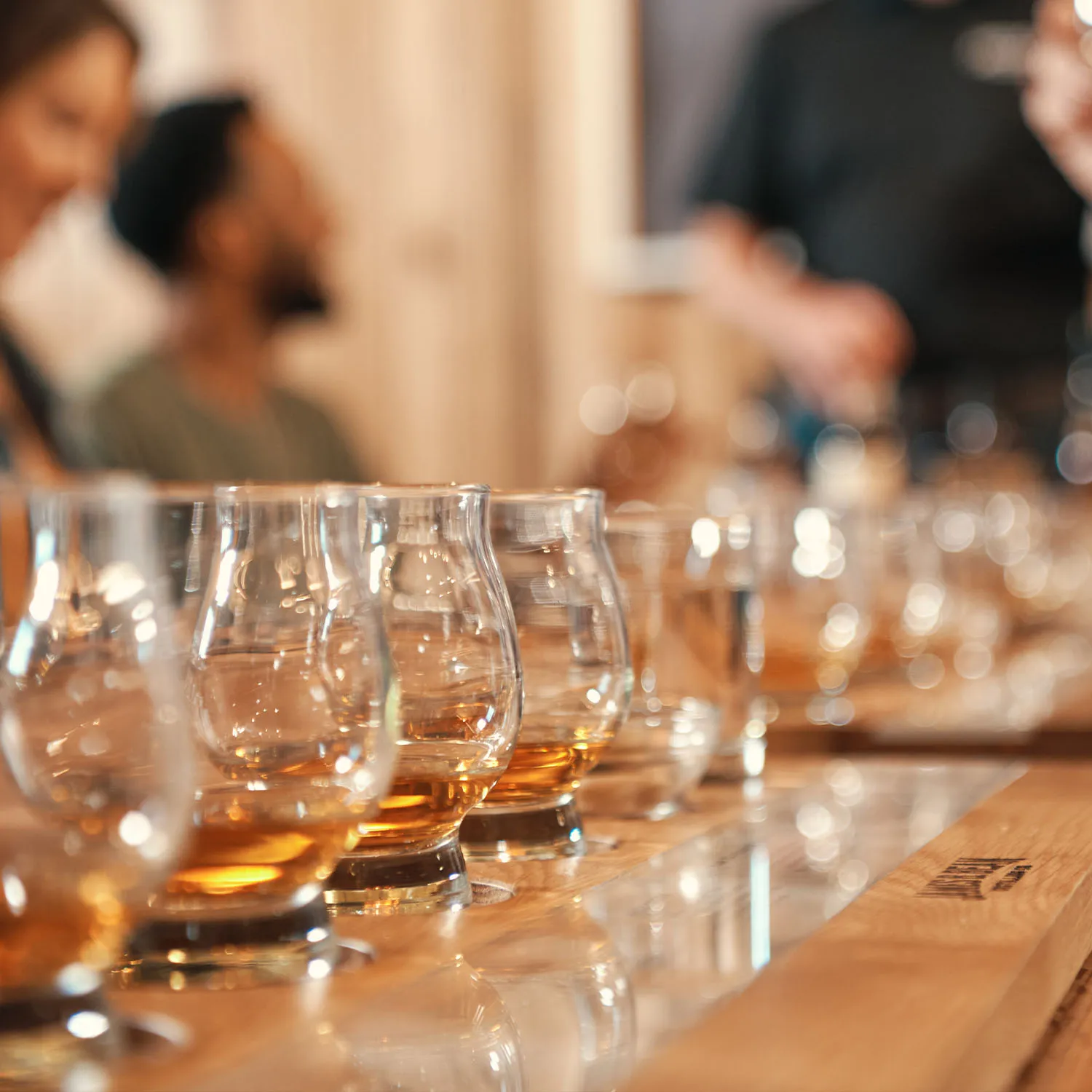 Close-up of tasting mats with glasses set for a bourbon and whiskey experience at James B. Beam Distilling Co.